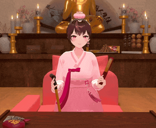 a girl in a pink dress is sitting in a chair holding a fan