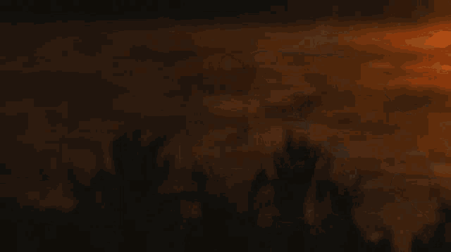 a bunch of flames flying in the air on a dark background