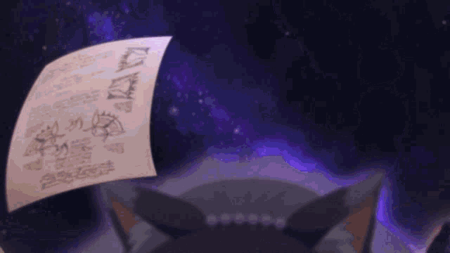 a piece of paper with drawings on it is floating in the air