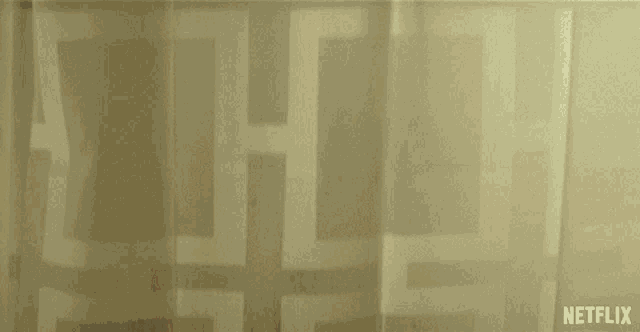 a netflix ad shows a person washing their hands in the shower