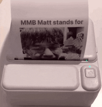 a white printer with a picture of a boy and the words mmb matt stands for on it