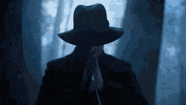 a man in a hat is holding a microphone