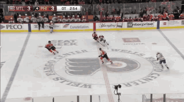 a hockey game is going on at the wells fargo center