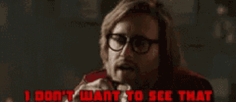 a man wearing glasses and a red vest says i don 't want to see that