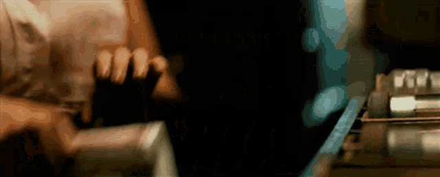 a blurry picture of a person 's hands holding something