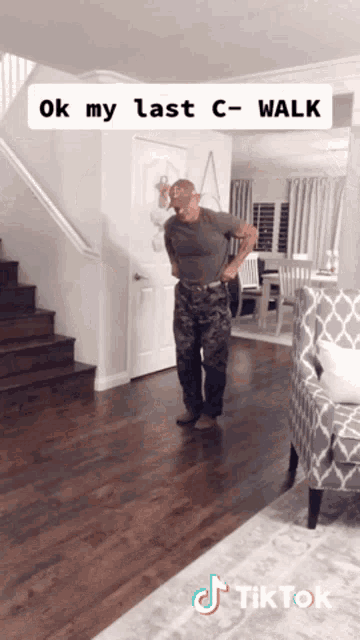 a man standing in a living room with the words ok my last c-walk written on the bottom