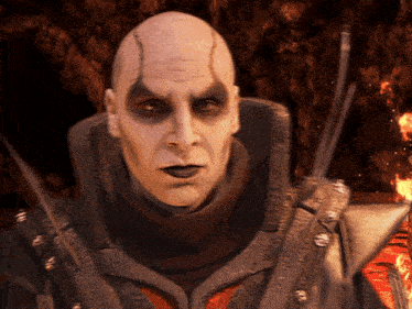 a bald man in a black and red costume with a sword in his hand