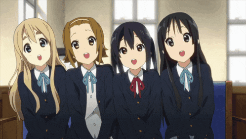 four anime girls are sitting next to each other in a room