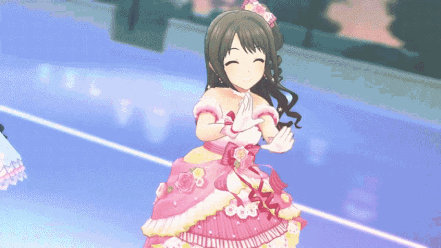 a girl in a pink dress with flowers on it is smiling