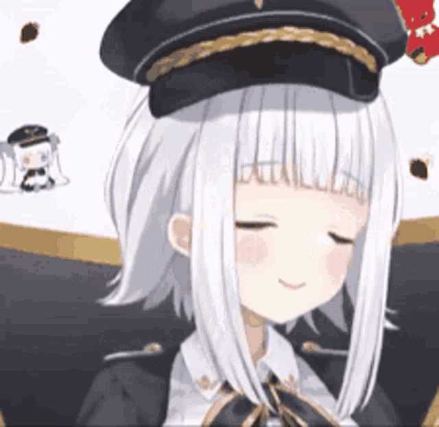 a girl with white hair is wearing a black hat and sitting in a chair .