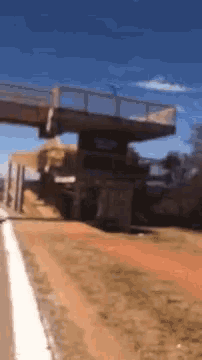 a bridge with a blue sky in the background