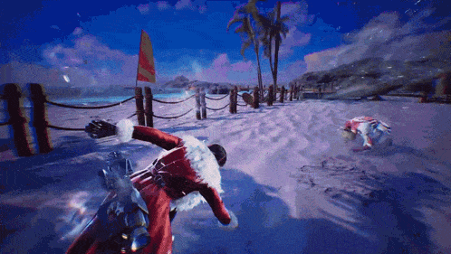 a man in a santa suit is riding a bike on a beach