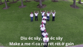a group of people are standing in a circle with their arms in the air