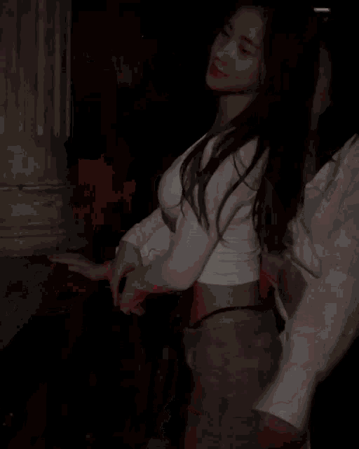a woman in a white crop top is dancing in a dark room with red lights behind her .