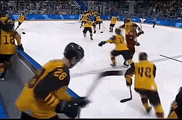 a hockey game is being played with a player wearing a number 28 jersey