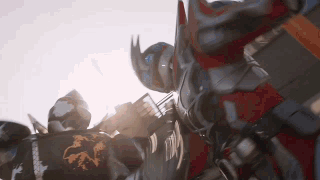 a close up of a robot with a shield and a sword