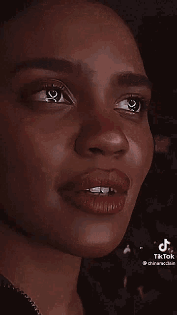 a close up of a woman 's face with a tik tok watermark
