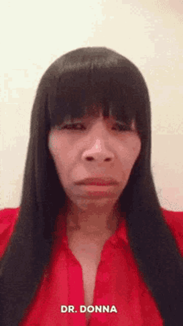 a woman in a red shirt with the name dr. donna on the bottom