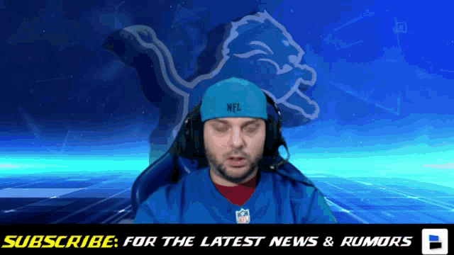 a man wearing headphones and a blue headband with the word nfl on it