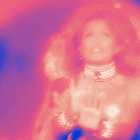 a blurry picture of a woman wearing a pearl choker