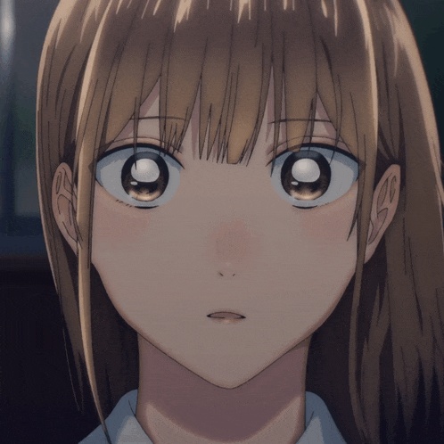 a close up of a girl 's face with a serious look on her face