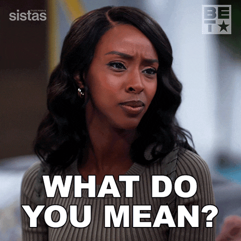 a woman says " what do you mean " while wearing a grey sweater