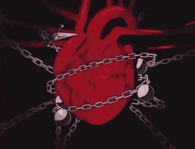 a red heart is chained to a metal chain