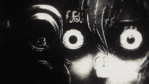 a black and white photo of a person 's face with the letters fbi visible