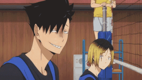 a couple of anime characters standing next to each other with one of them making a face