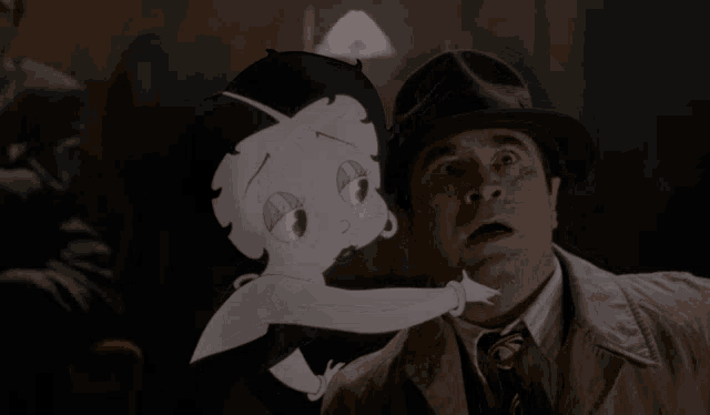 a man in a hat stands next to a cartoon character that looks like betty boop