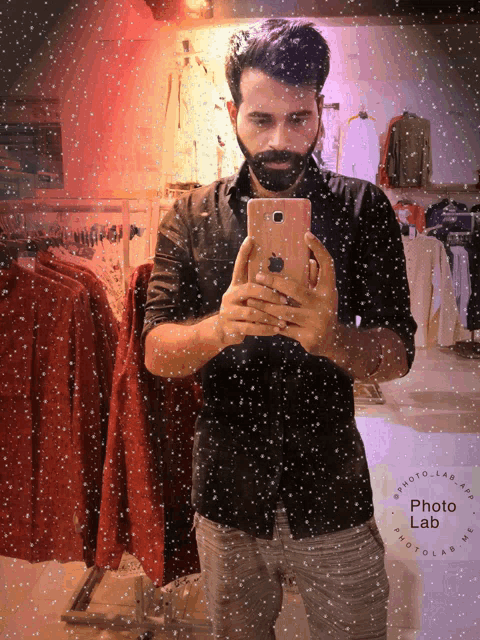 a man takes a picture of himself in a photo lab photo