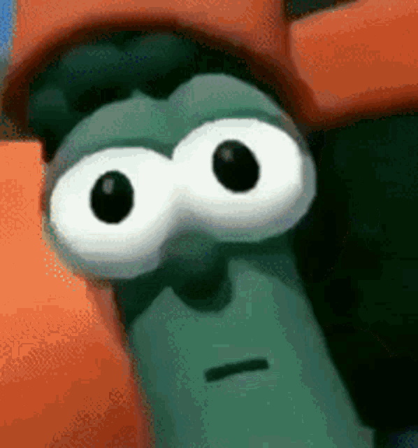 a close up of a cartoon character 's face with big eyes .