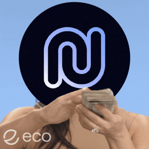 a woman is holding a stack of money in front of a black circle with the letter n on it