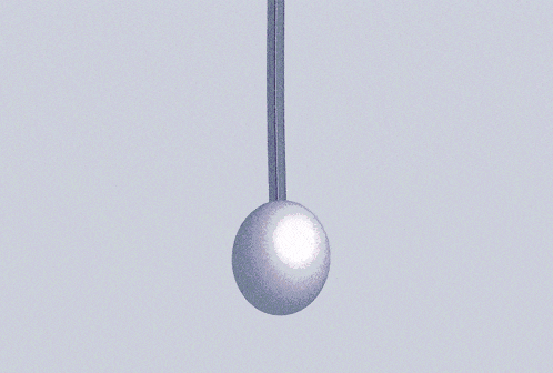 a red ball is hanging from a red string