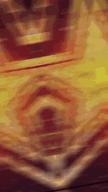 a blurry picture of a person 's face with a yellow background .