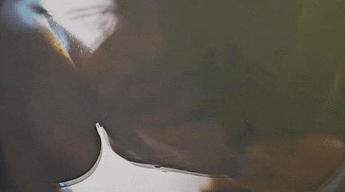 a man and a woman are kissing each other in a dark room .