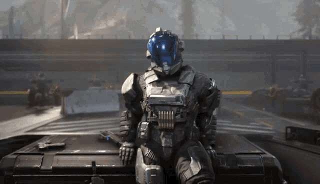 a man in a space suit is sitting on top of a vehicle