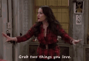 a woman is standing in a room with her arms outstretched and says `` grab two things you love . ''