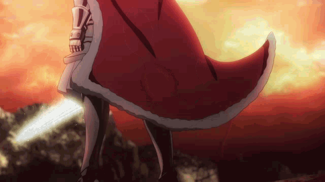 a person wearing a red cape holding a sword