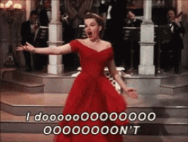 a woman in a red dress is singing a song and says i dooooo000000 ooooooon t