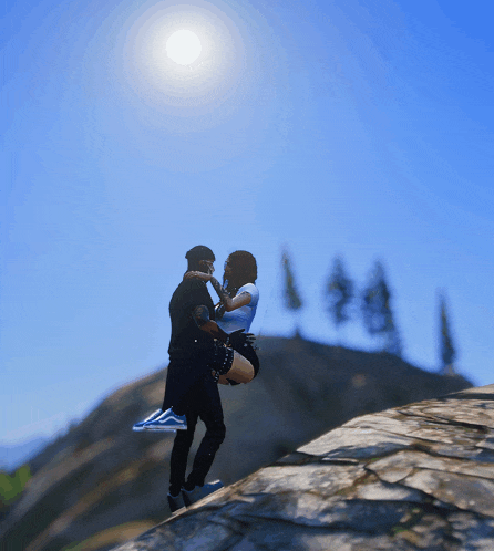 a man is holding a woman in his arms on a rocky hillside