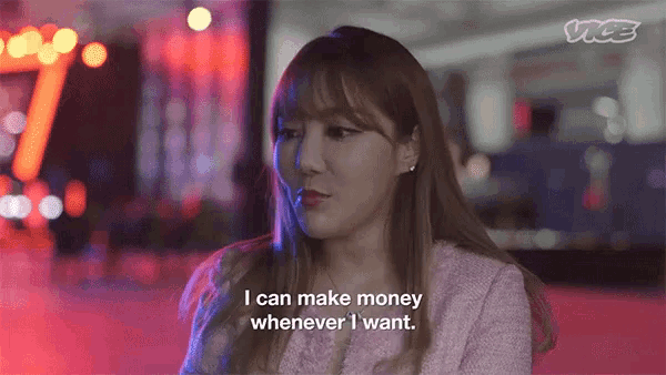 a woman is talking about making money whenever she wants .