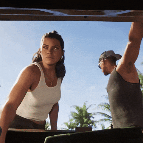 a woman in a white tank top stands next to a man in a baseball cap