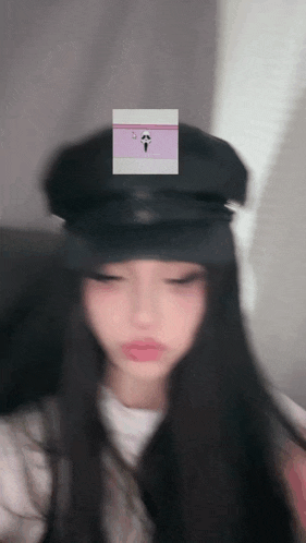 a blurry picture of a girl wearing a hat
