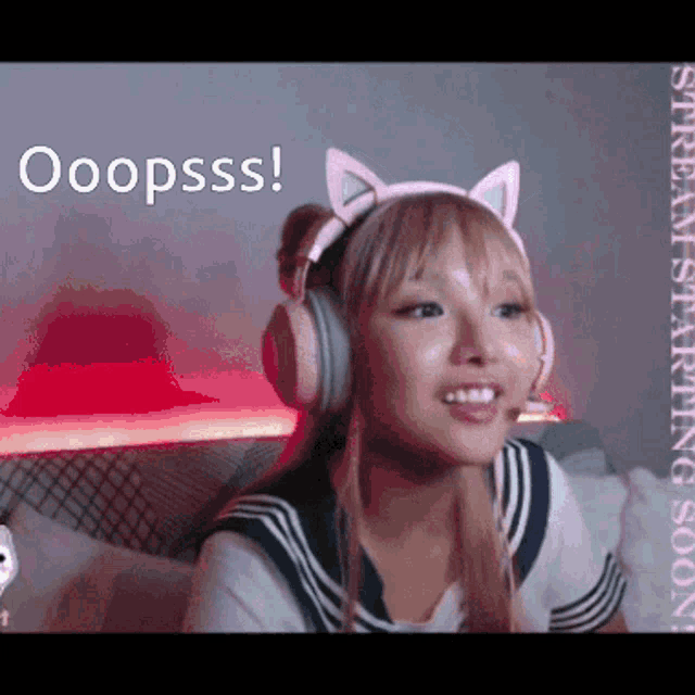 a girl wearing headphones and a cat headband says ooopsss !