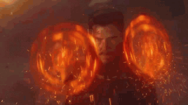 a large explosion with a lot of flames and sparks coming out of it .