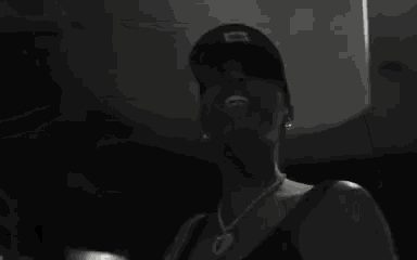 a black and white photo of a person playing a keyboard