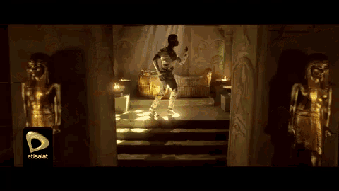 a man in a mummy costume is dancing in front of a sign that says elsalat