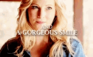 a close up of a woman 's face with the words `` and a gorgeous smile '' behind her .