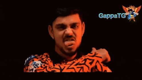 a man with a beard is giving the middle finger with gappatg written in the corner